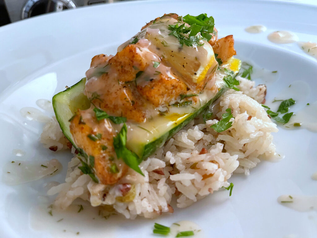 Spice Rubbed Salmon Stuffed Zucchini With Sultana and Pecan Rice and a Dill Butter Sauce